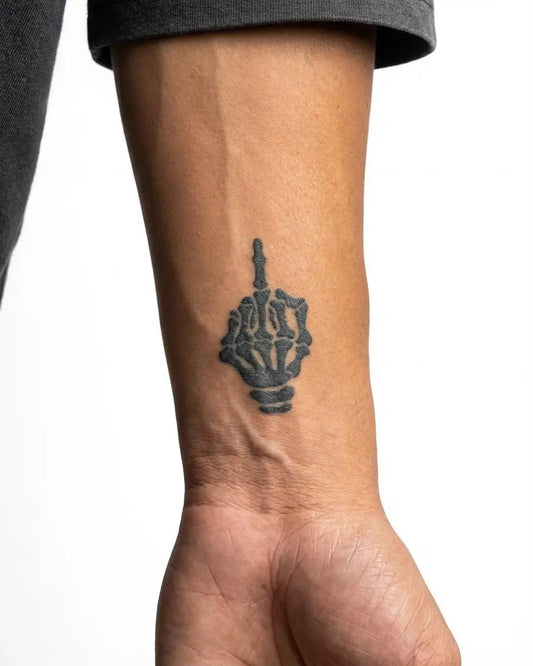 INKON Skeleton Middle Finger semi-permanent tattoo applied on a man – 2 x 2 in (5x5cm) design, realistic ink look, lasts 10 days