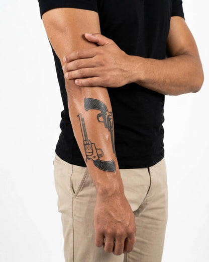 INKON Dual Revolvers semi-permanent tattoo applied on a man – 4 x 7 in (10x17cm) design, realistic ink look, lasts 10 days