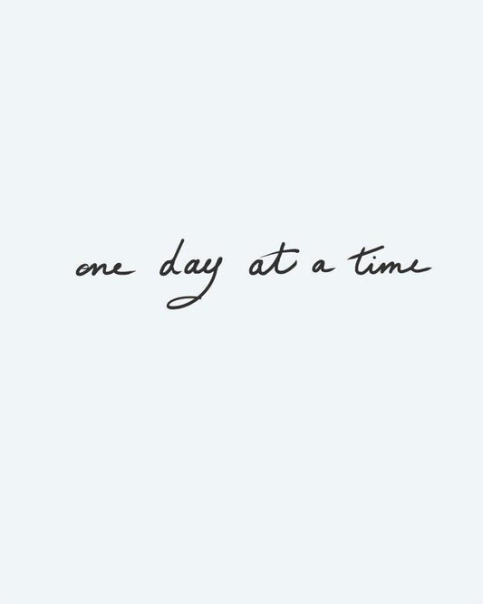 One Day at a Time semi-permanent tattoo design by INKON – handwritten, phrase, time, flowing, cursive illustration, 3 x 4 in (6x11cm), available at inkon.co