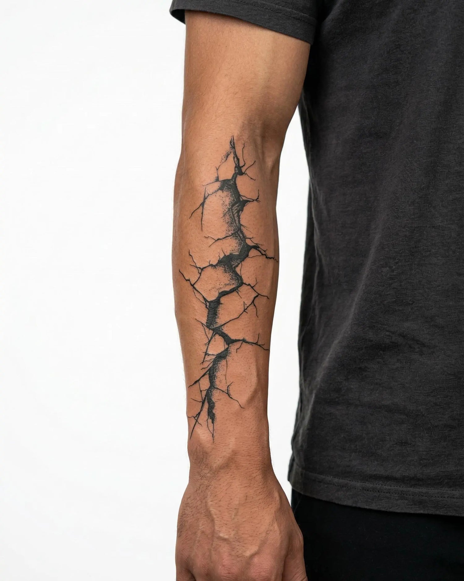 INKON Cracked Wall semi-permanent tattoo applied on a man – 4 x 8 in (11x21cm) design, realistic ink look, lasts 10 days