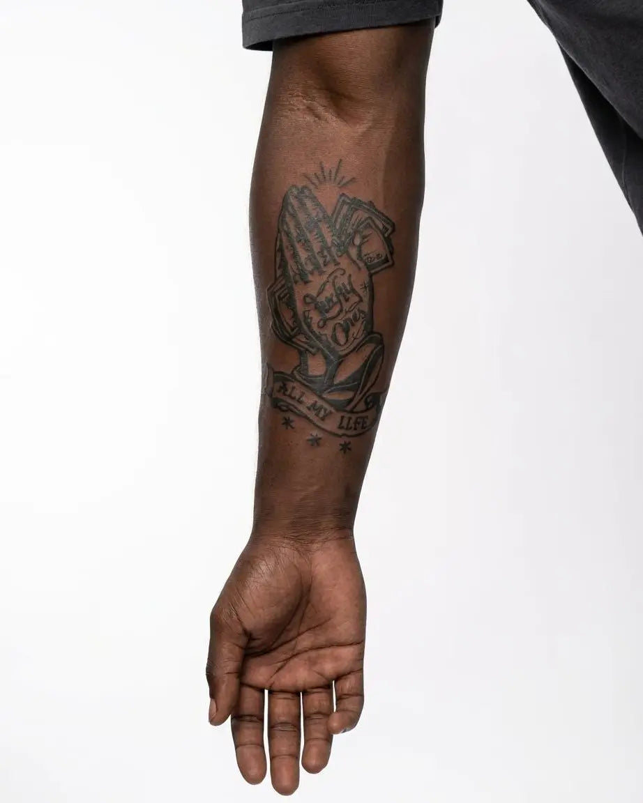 INKON Lucky Ones Praying Hands semi-permanent tattoo applied on a man – 4 x 7 in (10x17cm) design, realistic ink look, lasts 10 days