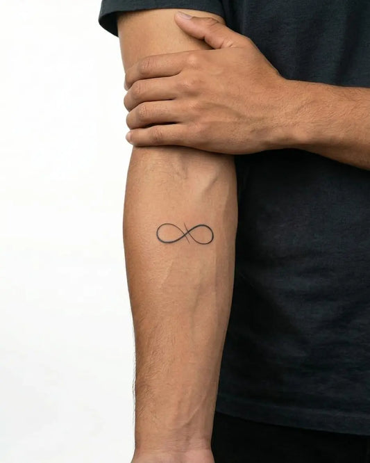 INKON Infinity Loop semi-permanent tattoo applied on a man – 2 x 2 in (5x5cm) design, realistic ink look, lasts 10 days