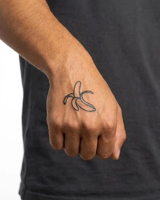 INKON Peeled Banana semi-permanent tattoo applied on a man – 2 x 2 in (5x5cm) design, realistic ink look, lasts 10 days