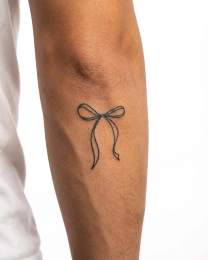 INKON Ribbon Bow semi-permanent tattoo applied on a man – 2 x 2 in (5x5cm) design, realistic ink look, lasts 10 days