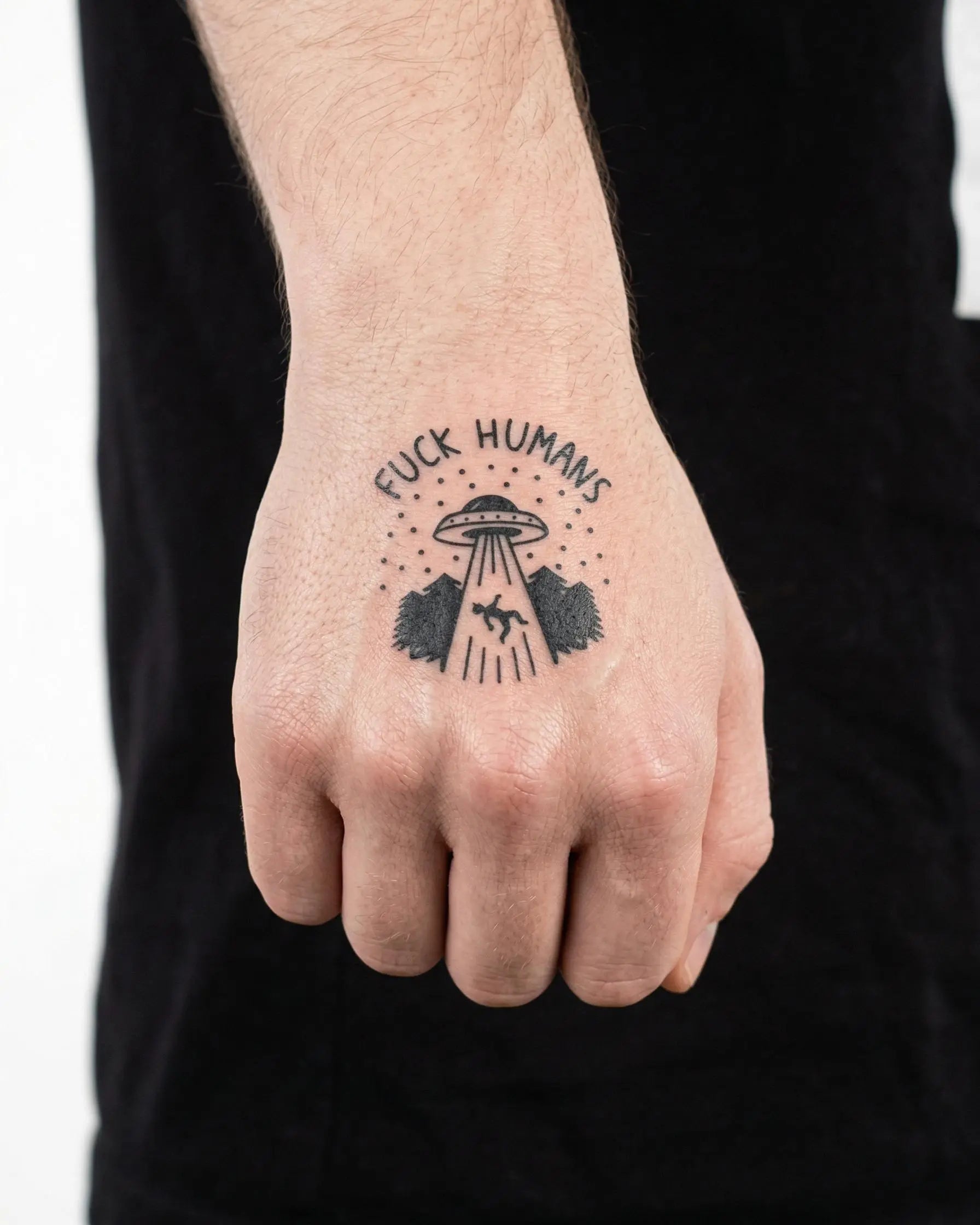 INKON UFO Abduction semi-permanent tattoo applied on a man – 2 x 2 in (5x5cm) design, realistic ink look, lasts 10 days
