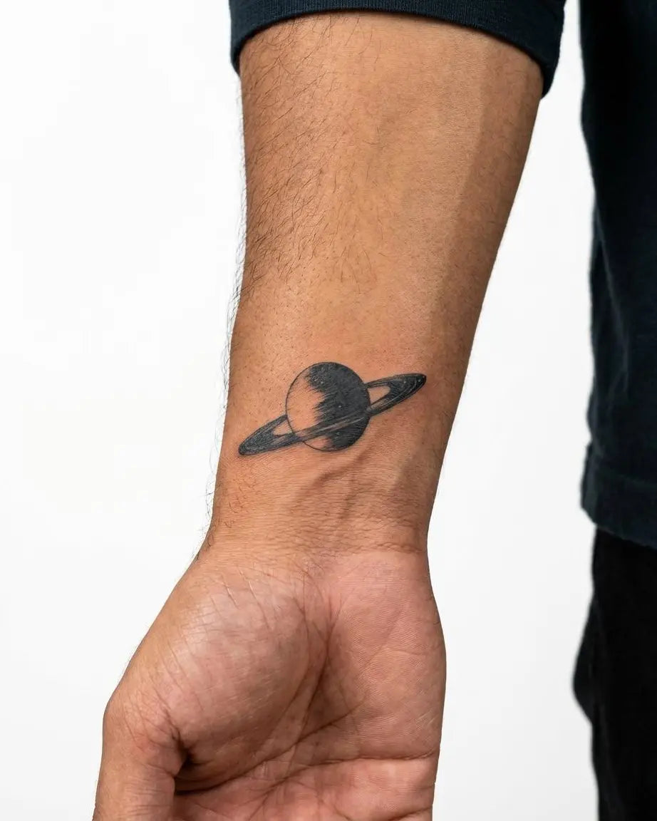 INKON Saturn Planet semi-permanent tattoo applied on a man – 2 x 2 in (5x5cm) design, realistic ink look, lasts 10 days